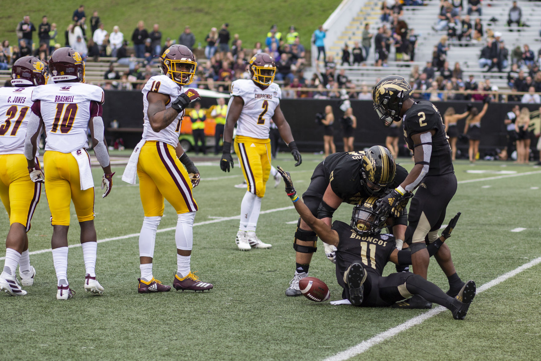 Sophomore WR Jaylen Hall (11) protests a no call after being tackled by Central Michigan's Willie Reid (19). Reid would later receive a targeting penalty.